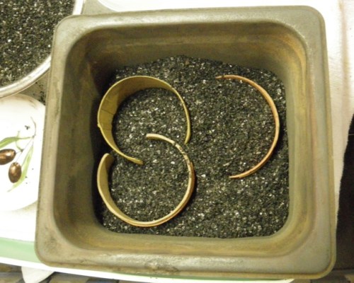 Base metal clays need to be fired in activated charcoal