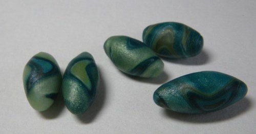 More scrappy beads. To be drilled after firing.