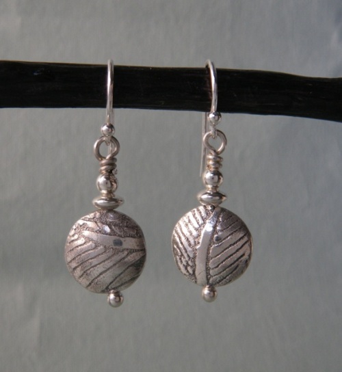 Fine silver saucer bead earrings.